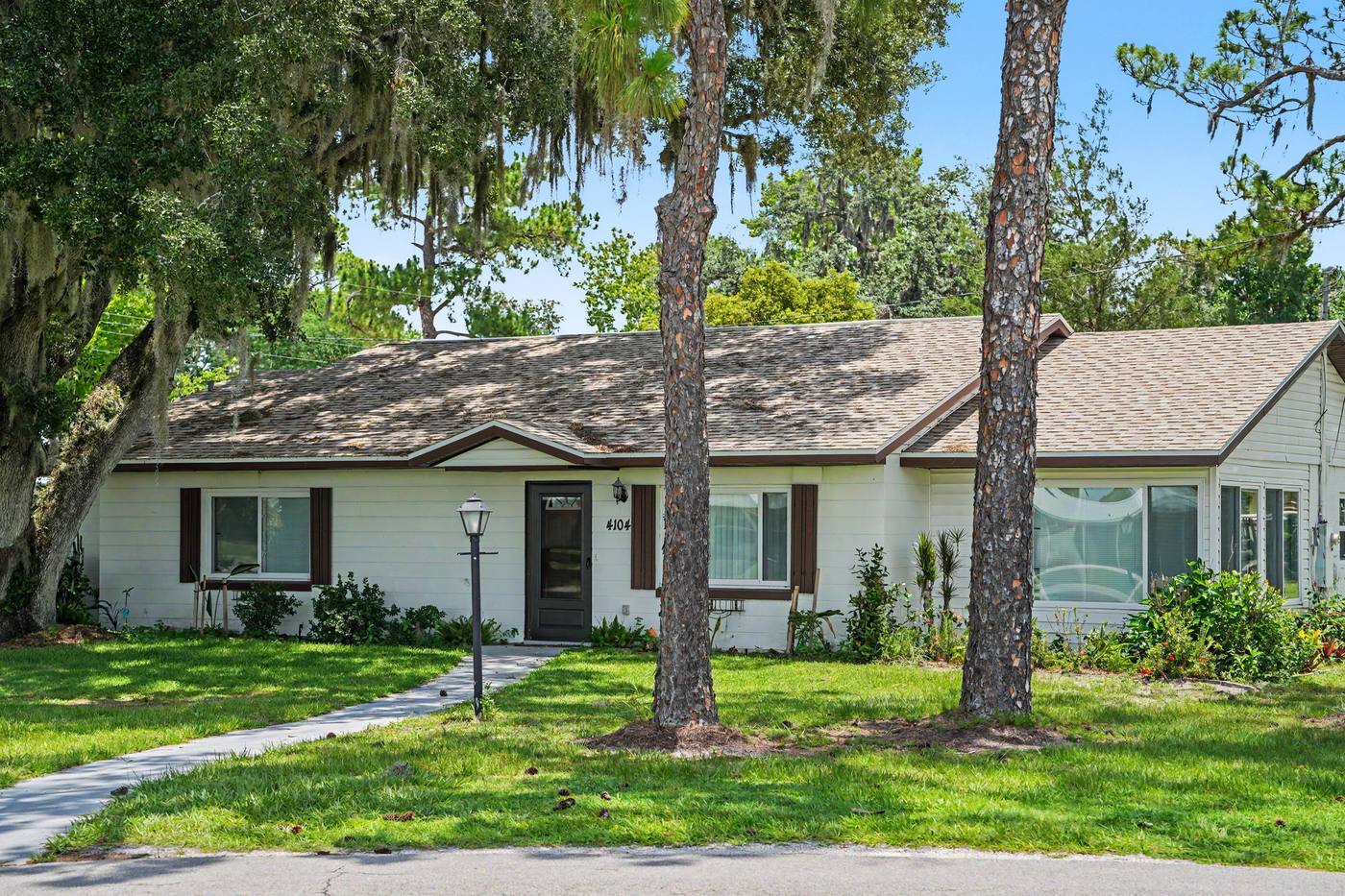A single-family home under tall pines
