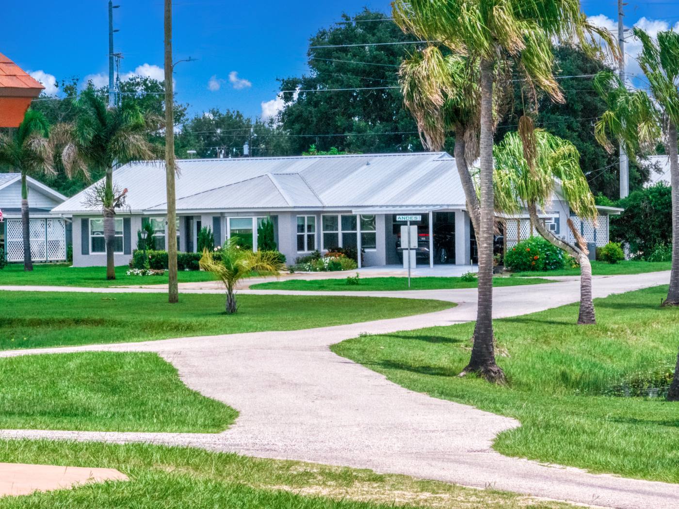 The Lodge, the Village's assisted living building, framed by palms